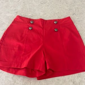 Red shorts, button detail. Size PM